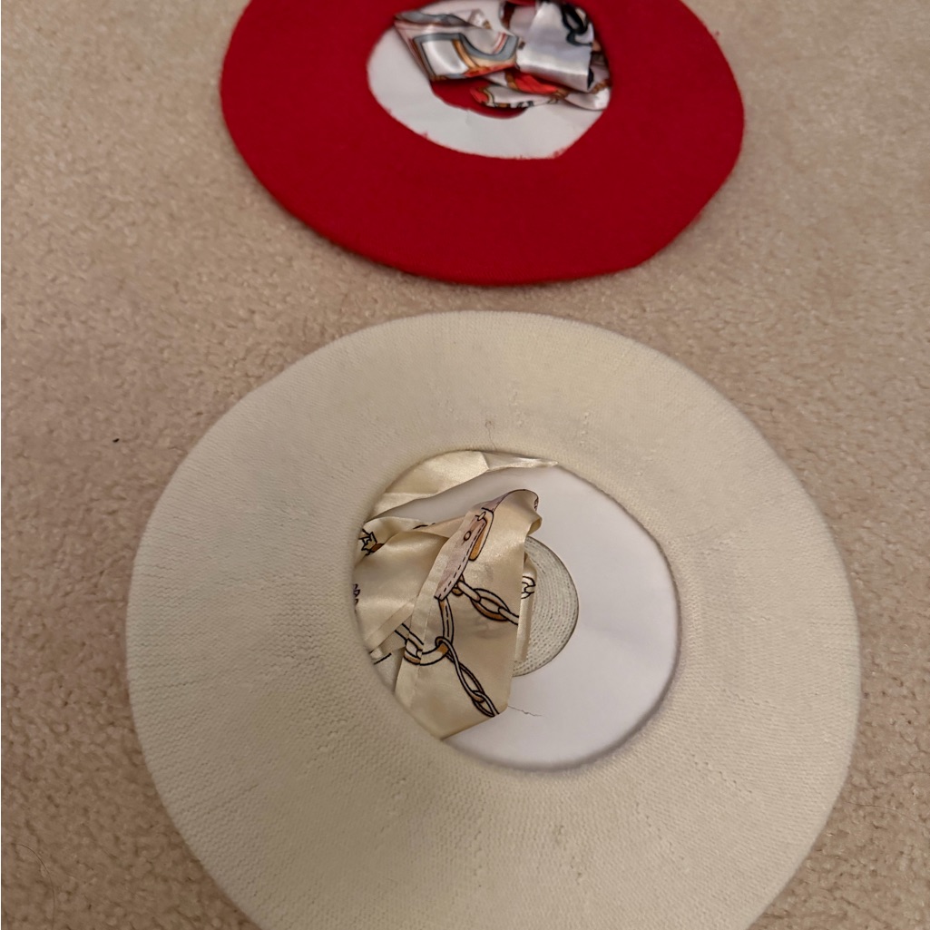 Red And Cream Circular Hats With Patterned Scarves